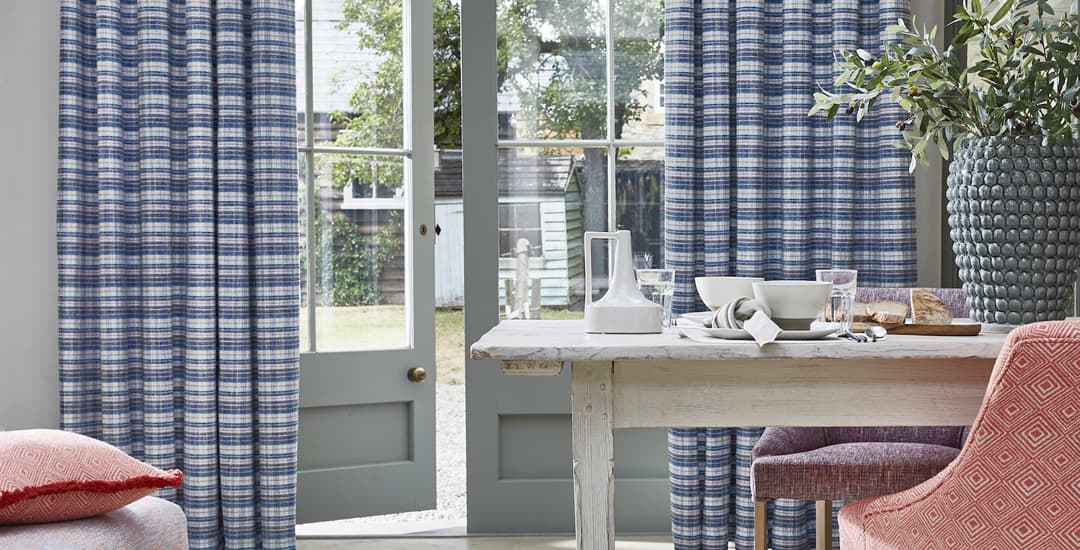 Blue and white striped curtains in kitchen diner