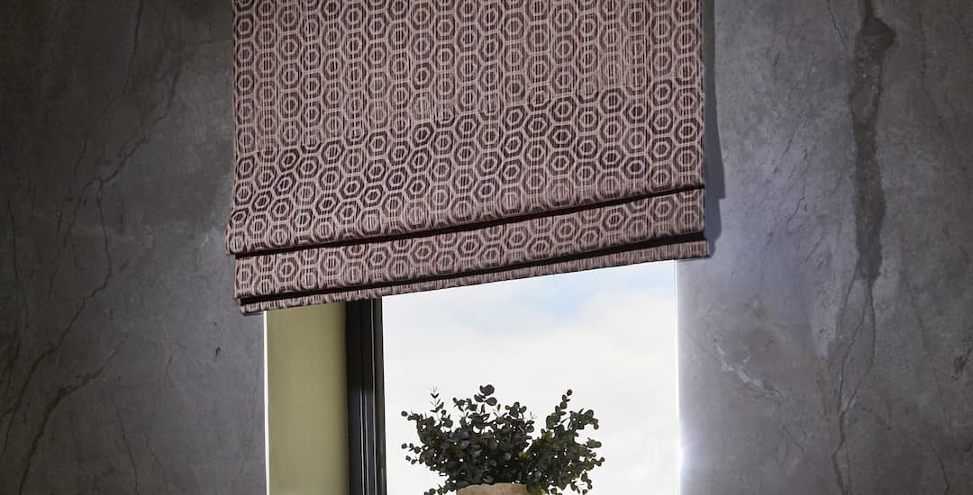 Brown blackout roman blind fitted outside the window recess