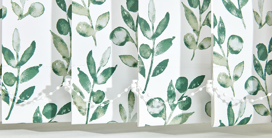Closeup of green floral polyester vertical blind fabric louvres