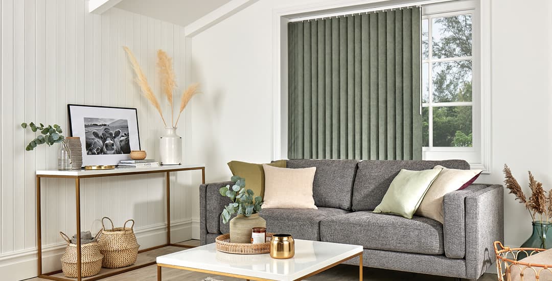Green vertical blinds in cosy living room