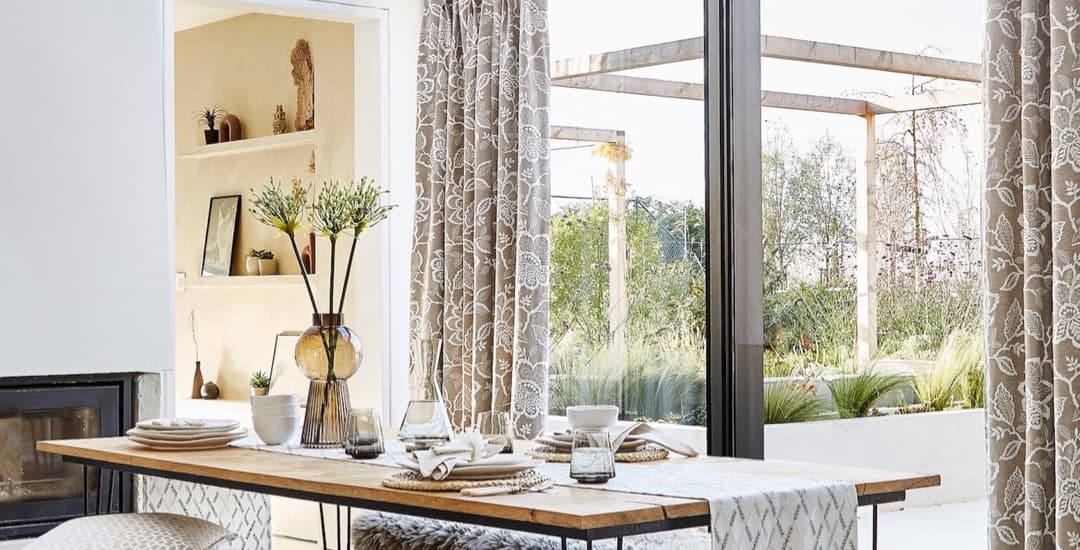 Luxury beige floral curtains in the dining area off the kitchen