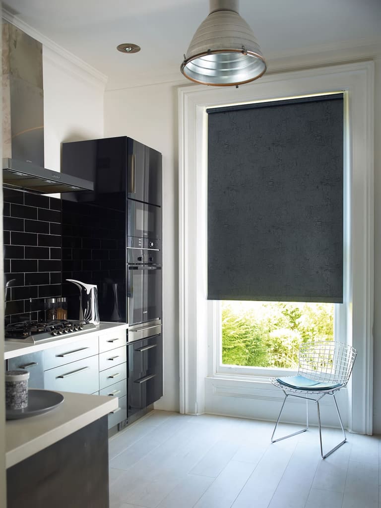 Black marble patterned PVC roller blinds in a modern black and white kitchen