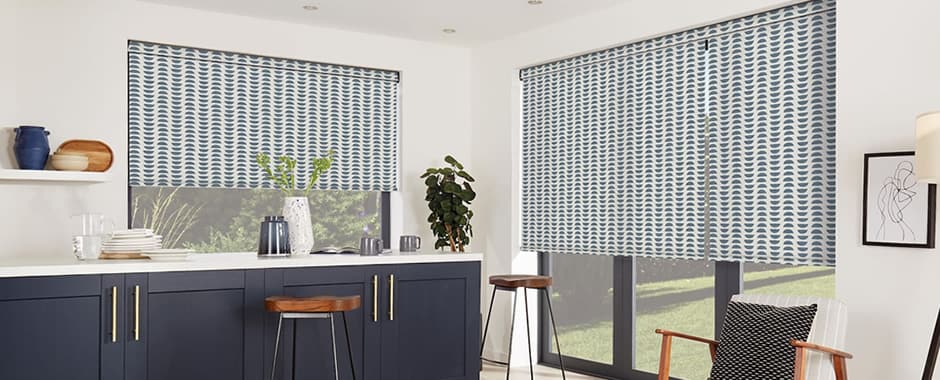Blue and white ikat inspired patterned roller blinds in a modern kitchen