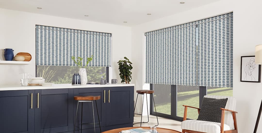 Blue and white ikat inspired patterned roller blinds in a modern kitchen