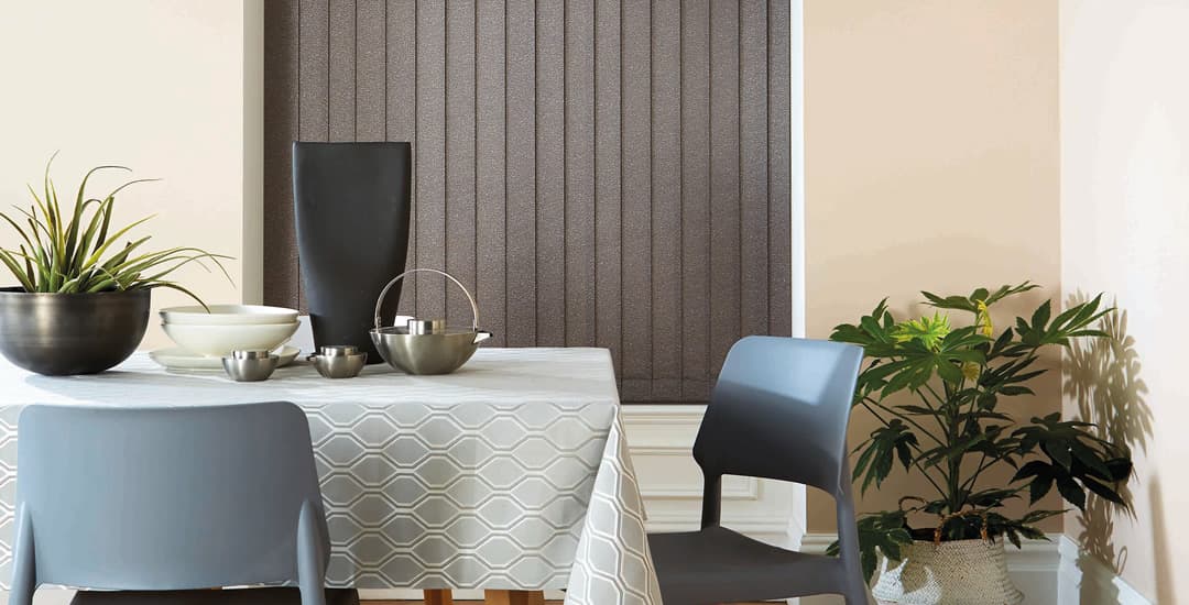 Brown thermal blackout vertical blinds in dining room