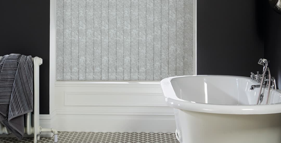 Closed grey and silver thermal blackout PVC vertical blinds in bathroom
