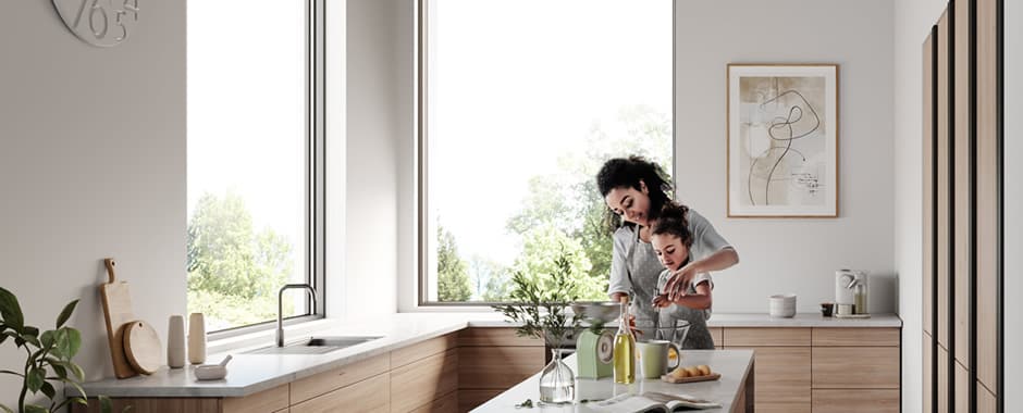 Invisible blinds at the large windows of a luxurious modern kitchen