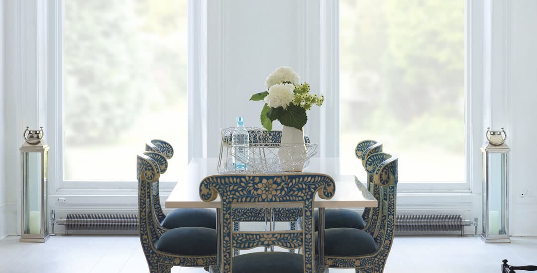 Invisible blinds in a stylish white dining room