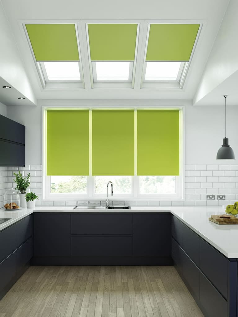 Lime green roller blinds in a modern slate grey kitchen