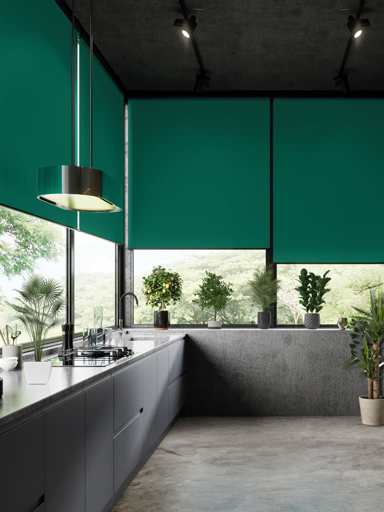Lush green roller blinds in an ultra-modern kitchen with lots of plants