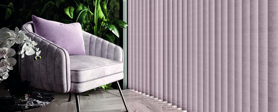 Partially opened lilac vertical blinds in tropical themed sitting room