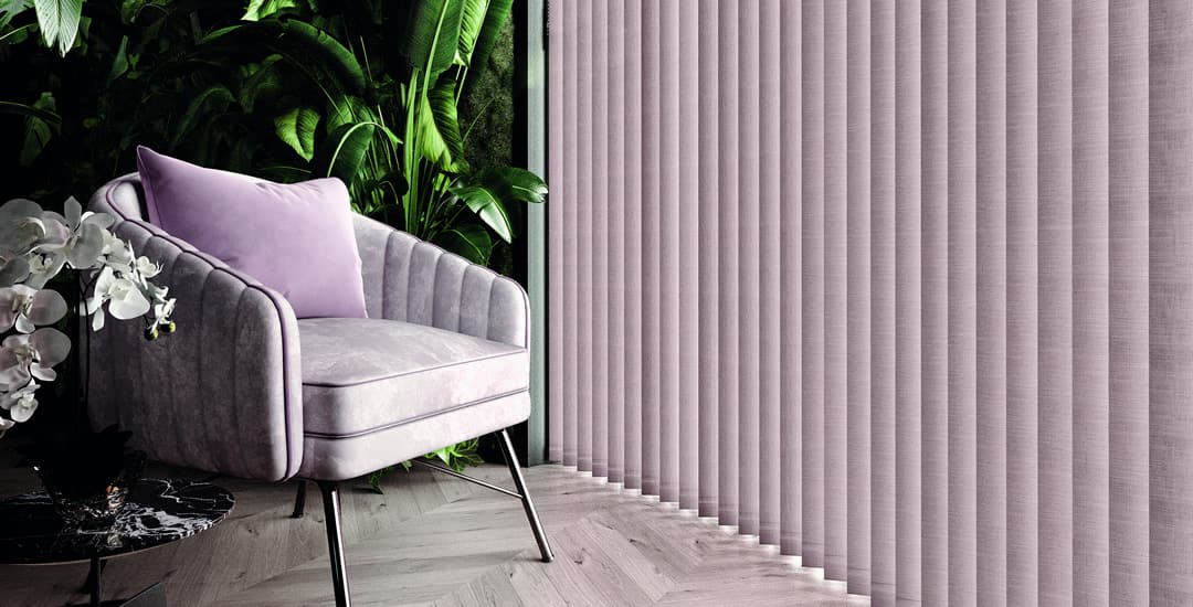 Partially opened lilac vertical blinds in tropical themed sitting room