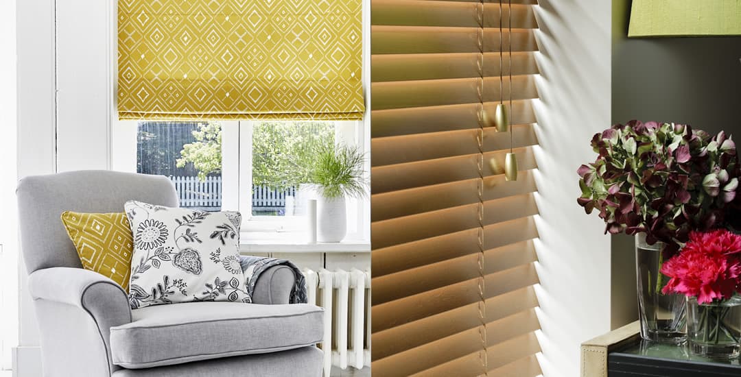 Yellow patterned roman blinds and honey real wood Venetian next to each other