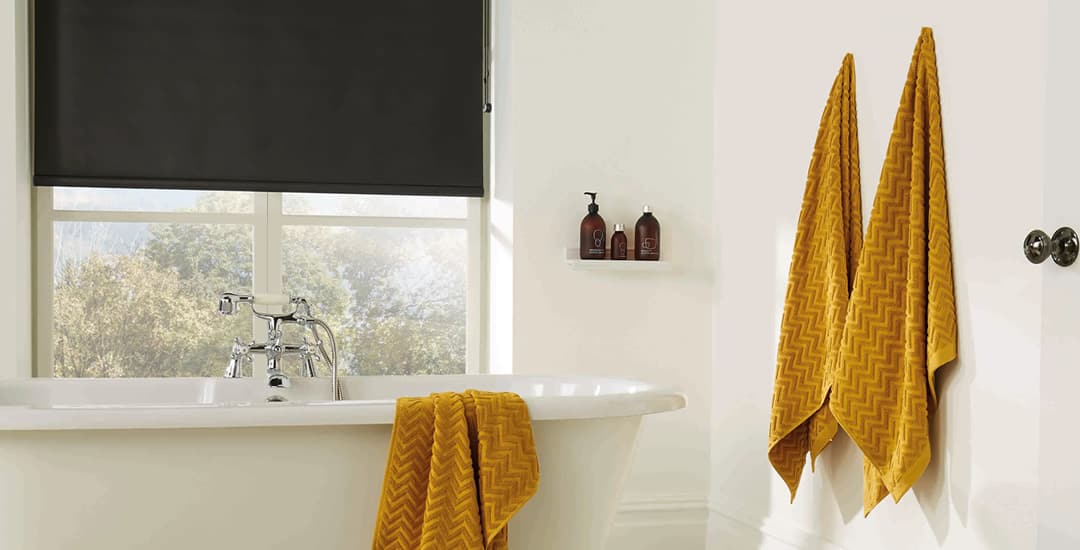 Black PVC roller blinds in a small bathroom