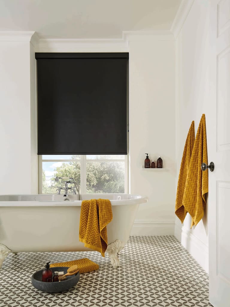 Black PVC waterproof roller blinds in traditional cream bathroom 