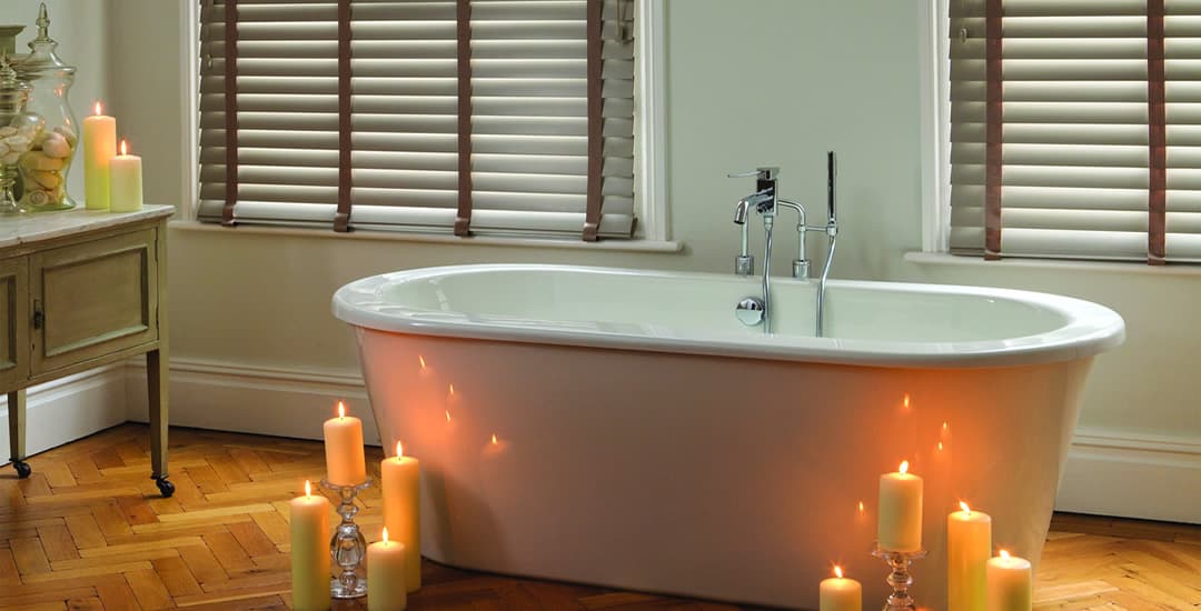 Faux wood blinds with tapes in a romantic bathroom