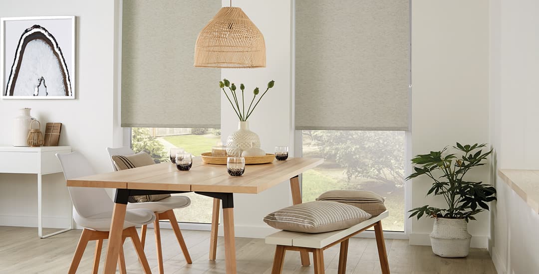 Beige textured roller blinds in a modern dining room