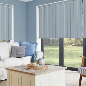 Blue striped blackout roller blinds in a coastal themed living room