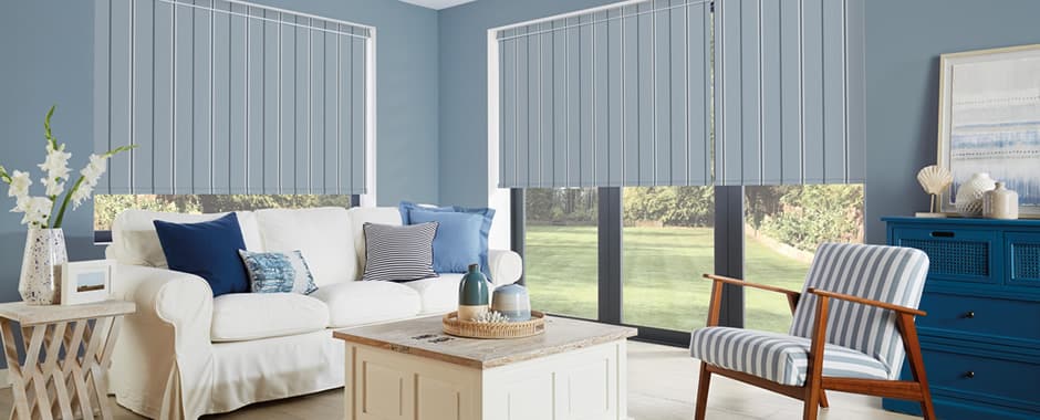 Blue striped blackout roller blinds in a coastal themed living room