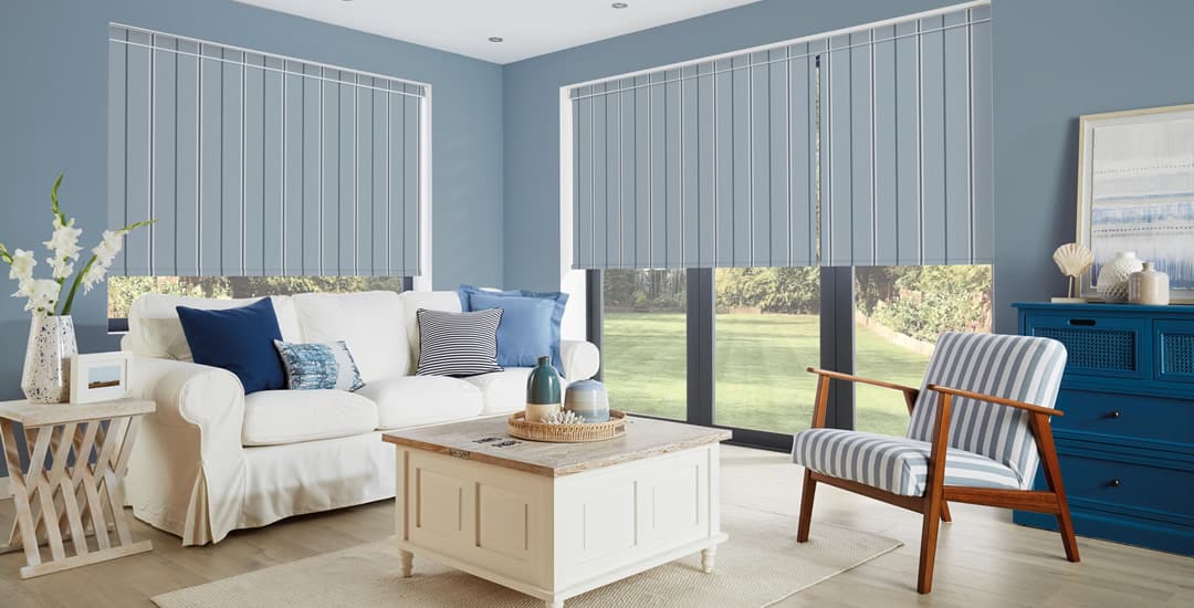 Blue striped blackout roller blinds in a coastal themed living room
