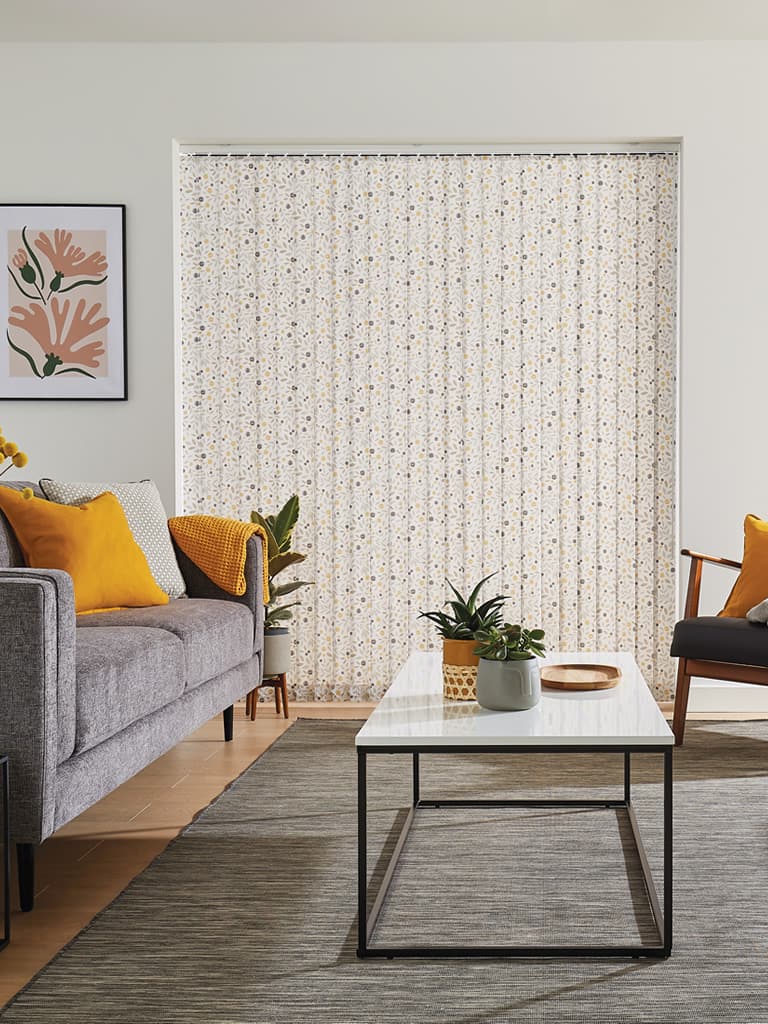 Cream floral patterned vertical blinds in a retro cream living room