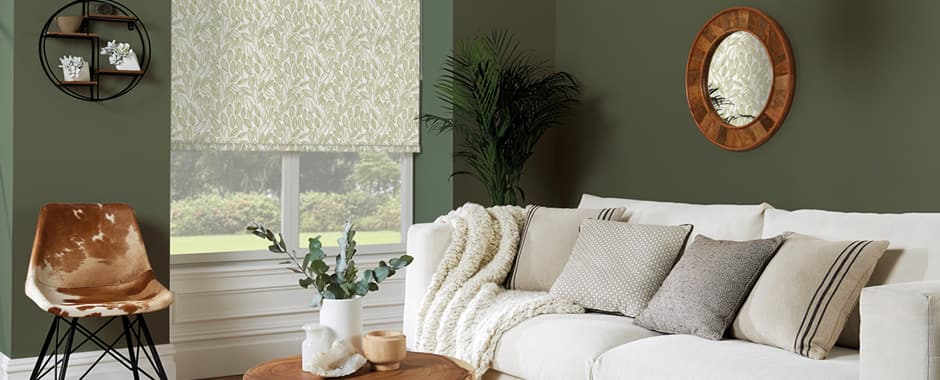 Green leaf patterned made-to-measure roller blinds in green and white living room