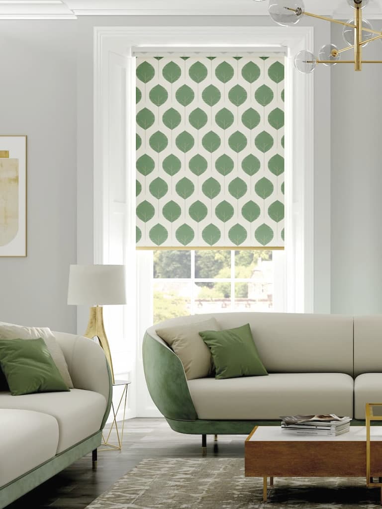 Green tree silhouette patterned roller blinds in a retro cream and green living room