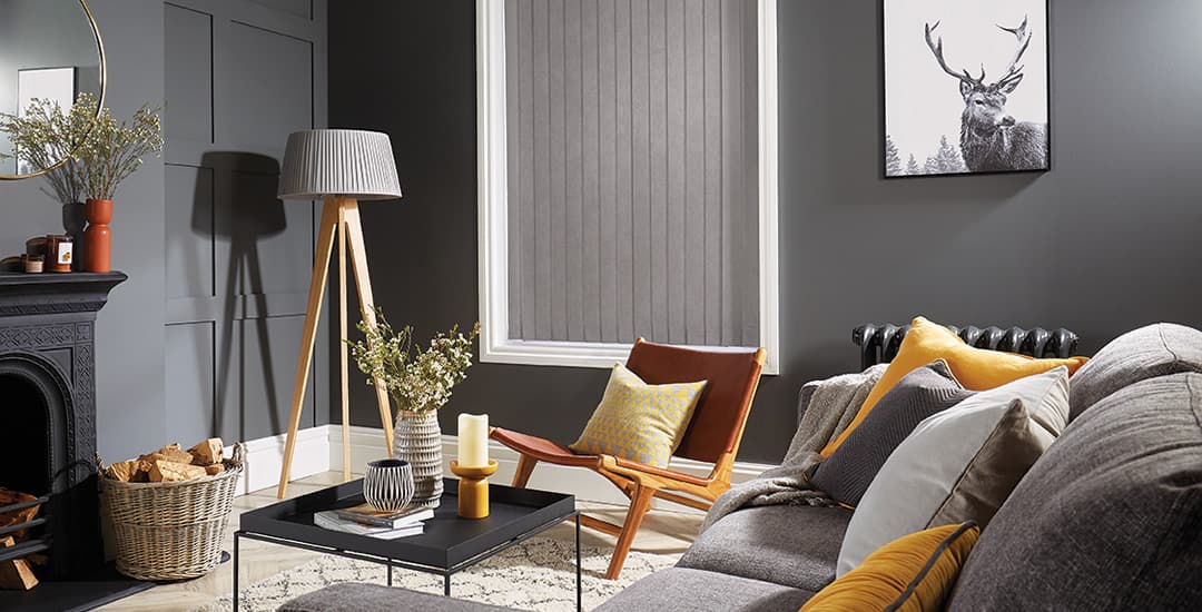 Grey blackout vertical blinds in a modern grey living room