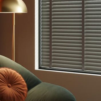 Luxury real wooden blinds with coordinating ladder tapes in a modern orange sitting room
