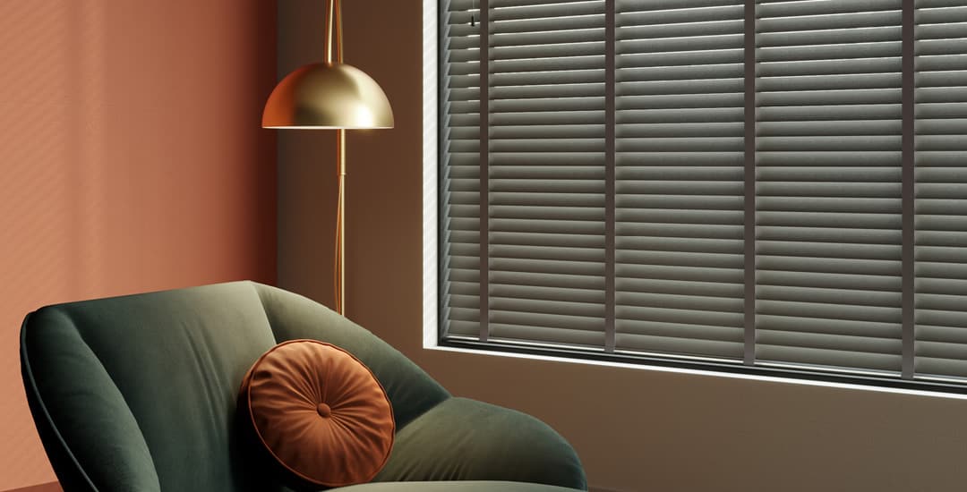 Luxury real wooden blinds with coordinating ladder tapes in a modern orange sitting room