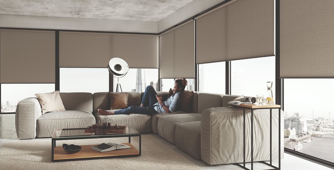 Plain brown textured roller blinds in a modern apartment
