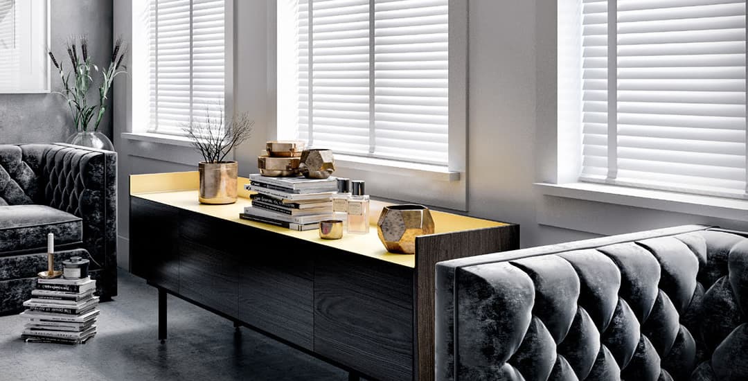 White wooden blinds with tapes in a traditionally styled living room