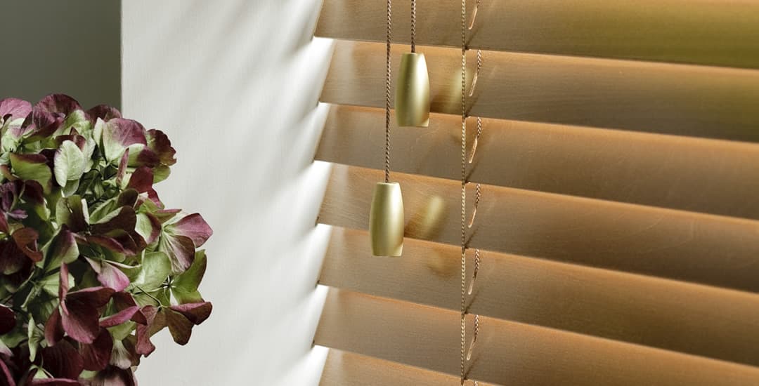 Closeup of real wooden blind with slats closed downwards