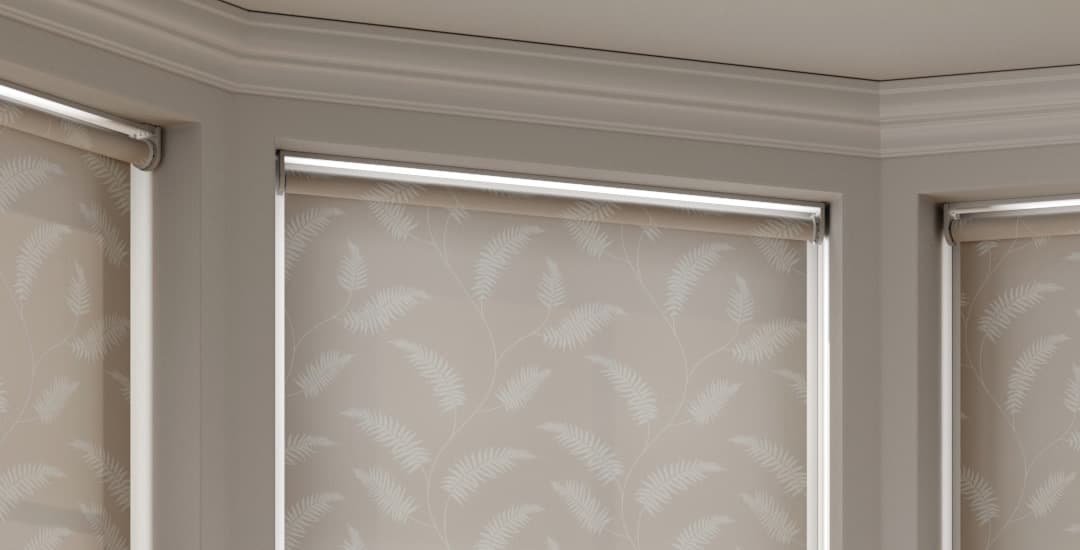 Close up of roller blinds and brackets in a bay window