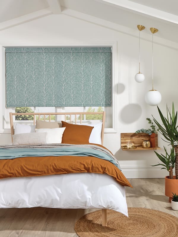 Duck egg blackout blinds in a colourful snug bedroom