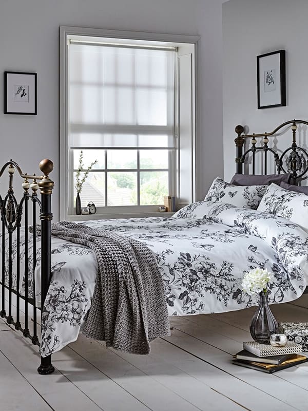 White roller blinds in a gorgeous vintage bedroom