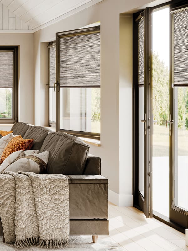 Luxury brown textured roller blinds in sun room