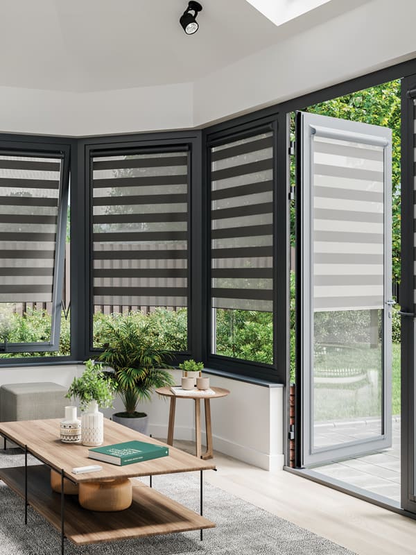 Modern black day and night blinds in conservatory