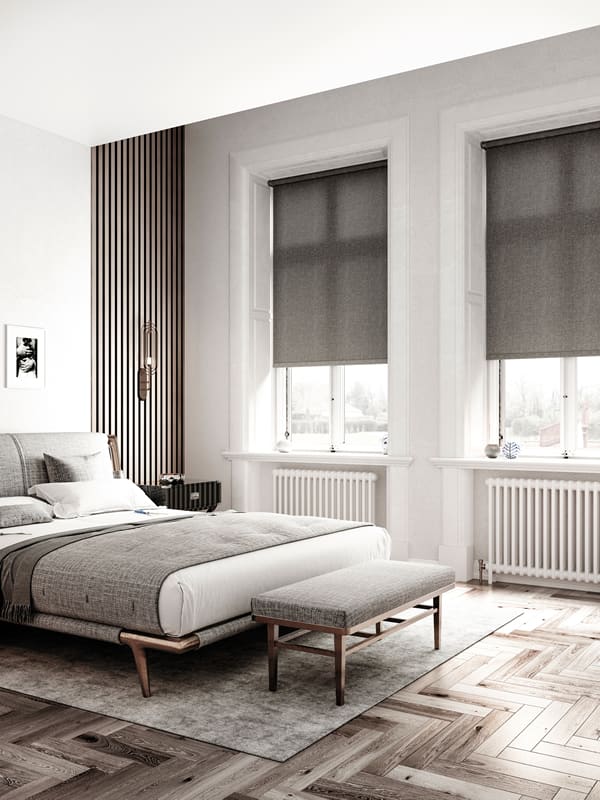Luxury natural textured fabric roller blinds in a modern bedroom