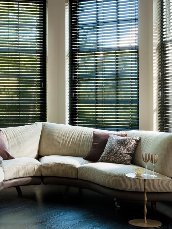 Premium dark wood venetian horizontal blinds in a bay window