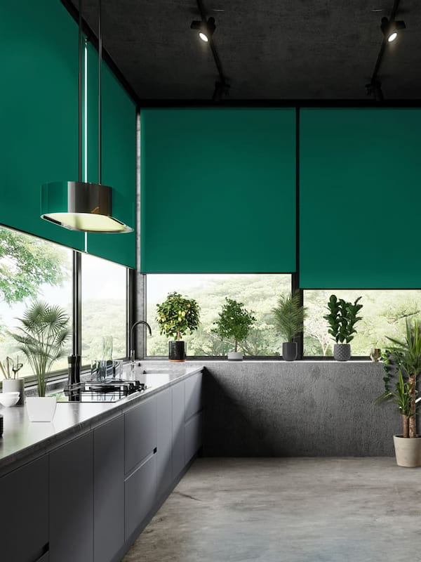 Lush green roller blinds in a stunning high end ultra-modern kitchen