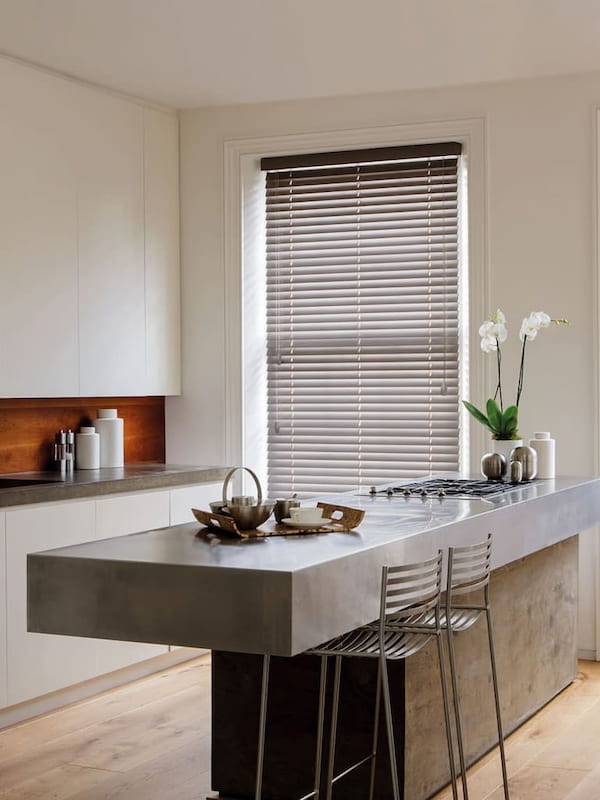 Luxury real wooden Venetian blinds in a stylish modern kitchen