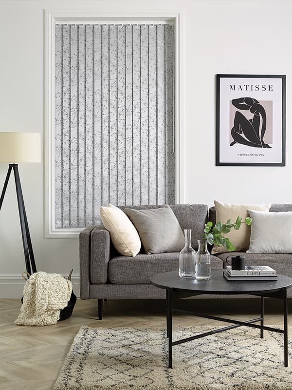 Grey vertical blinds in a contemporary grey and white living room