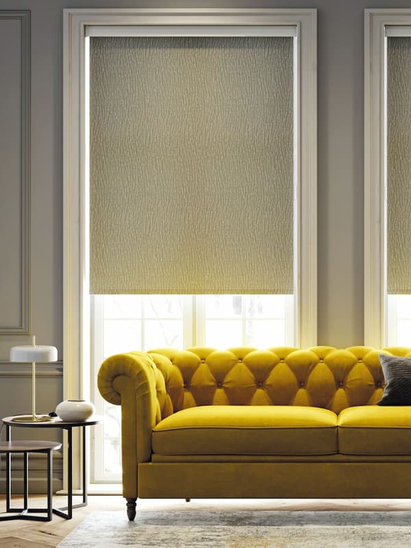 Luxury grey roller blinds in a traditional grey living room