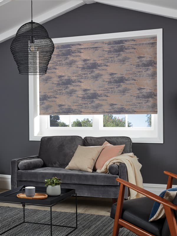 Luxury metallic copper roller blinds in a dark grey living room