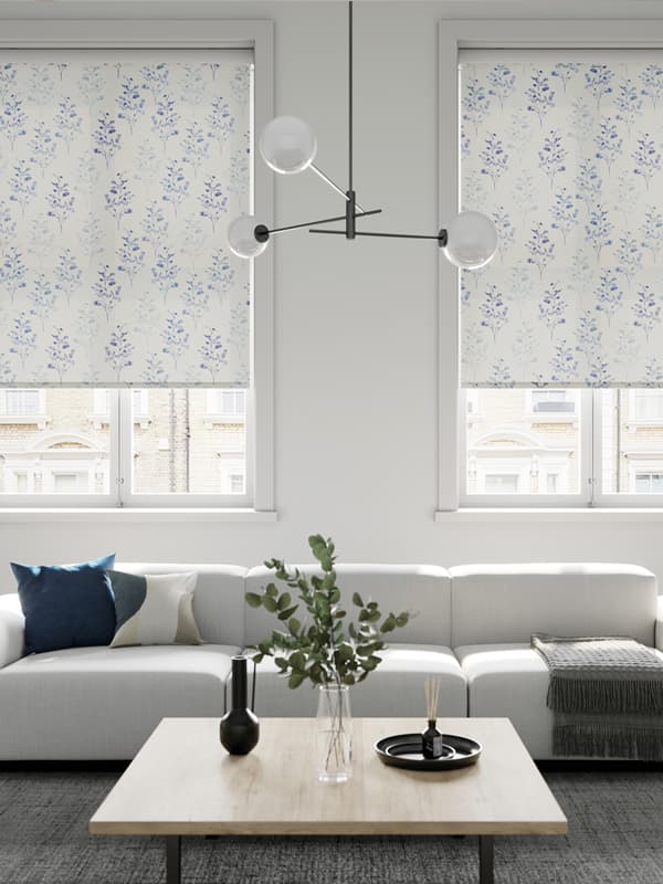 White floral roller blinds in a modern fresh white living room