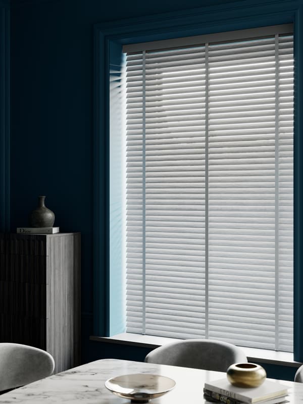 Grey faux wood louvre blinds with tapes in a modern dining room