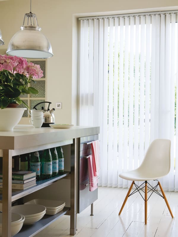 Made-to-measure quality white vertical louvre blinds in a modern kitchen