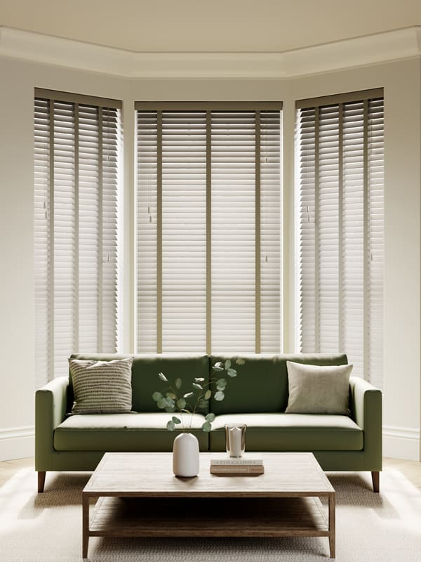 Light grey slatted-wooden blinds with contrasting tapes in living room